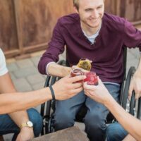 man with a wheelchair with his mates