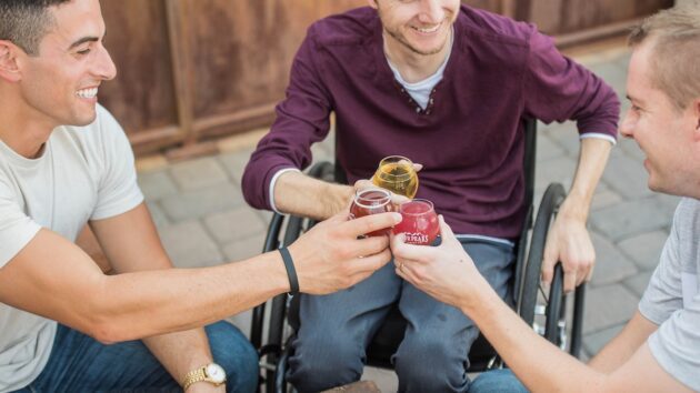man with a wheelchair with his mates